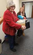 Carol and Dianne bringing goodies for the holiday potluck